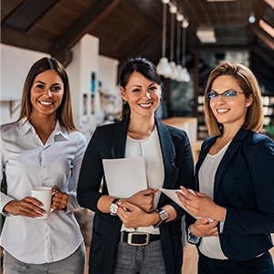 Three women smiling together